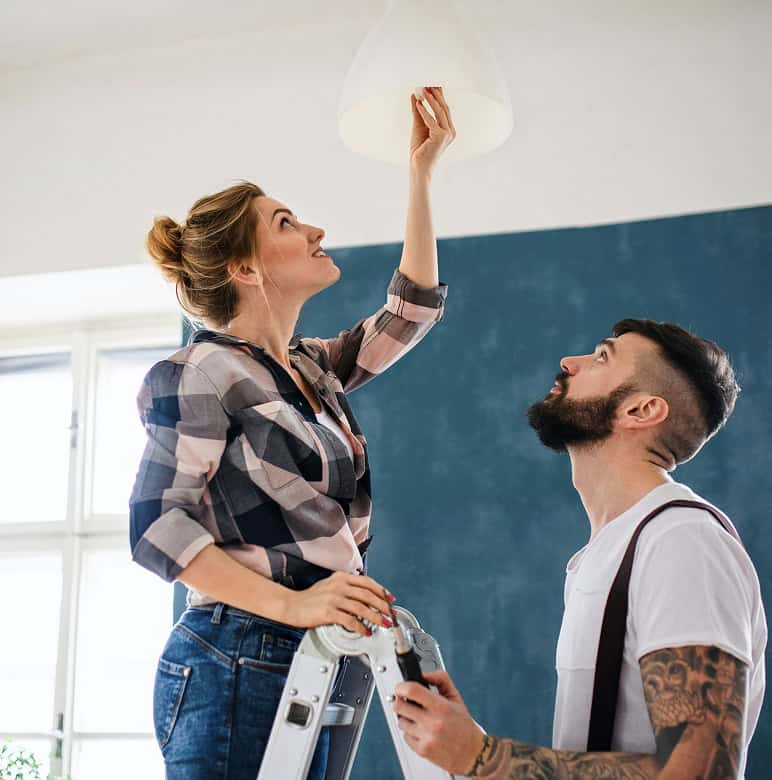 Happy couple redecorating their new home